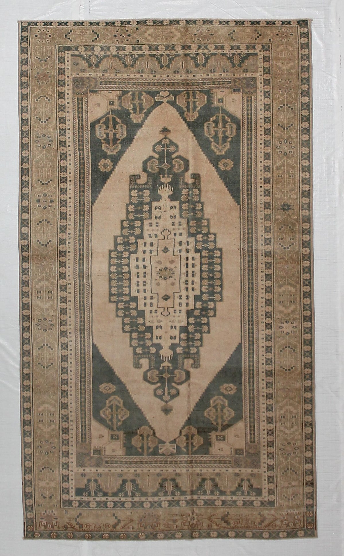 5x9 Ivory and Green Turkish Tribal Rug