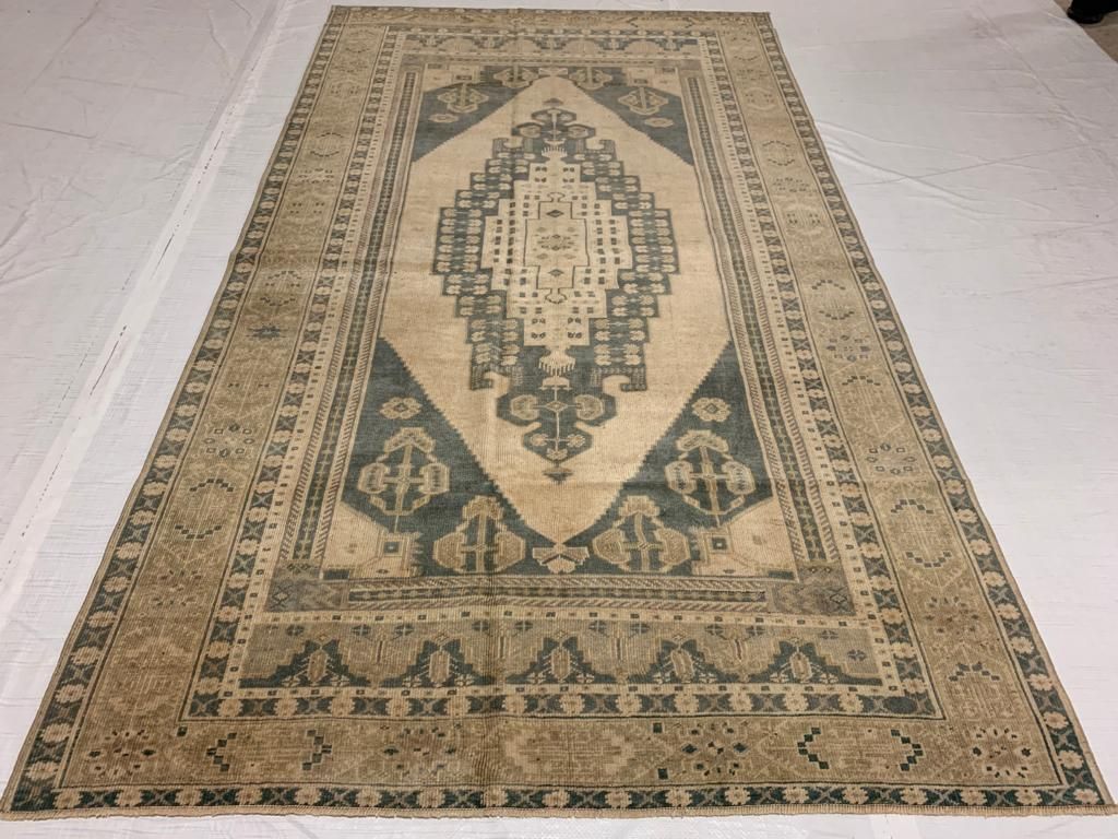 5x9 Ivory and Green Turkish Tribal Rug
