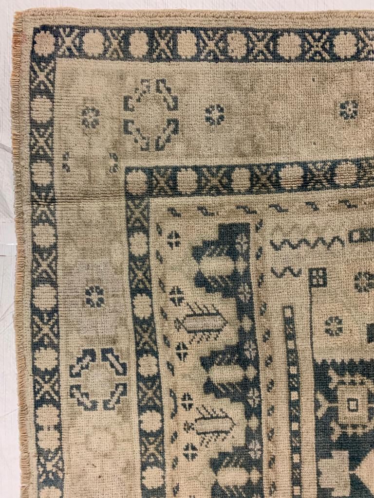 5x9 Ivory and Blue Turkish Tribal Rug