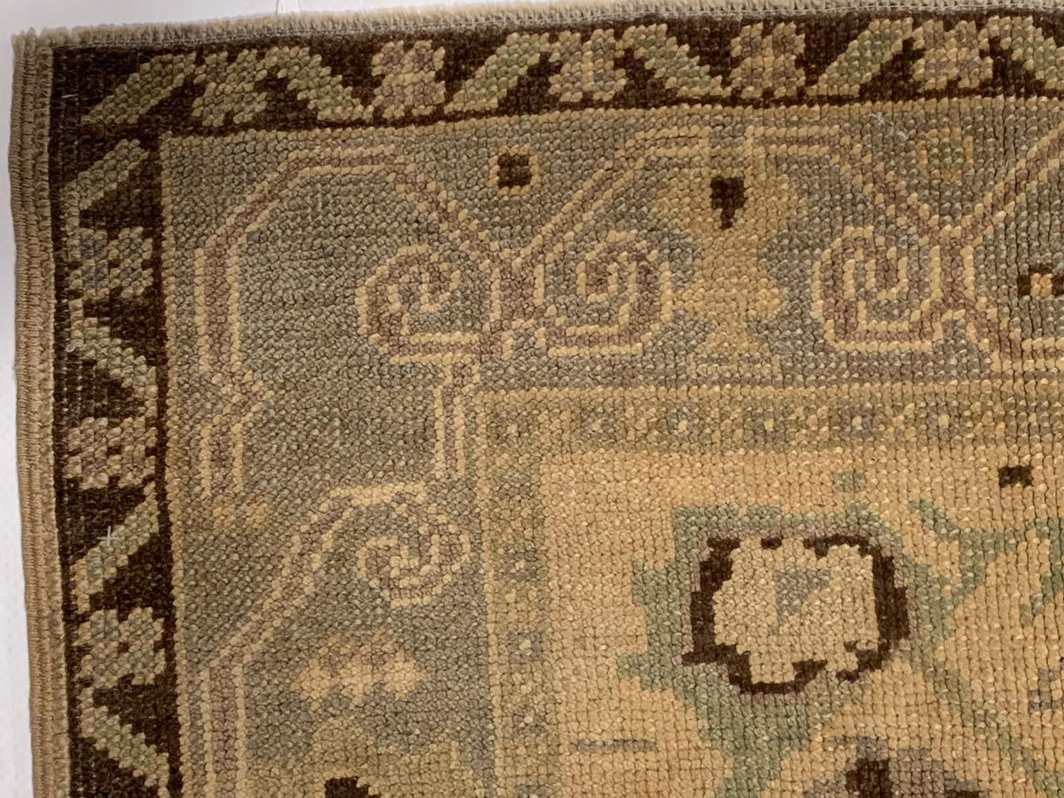 6x9 Ivory and Gold Turkish Tribal Rug
