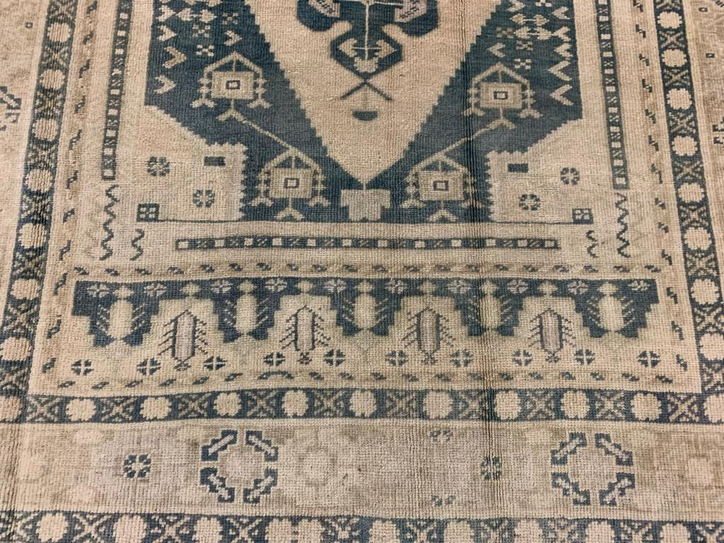 5x9 Ivory and Blue Turkish Tribal Rug