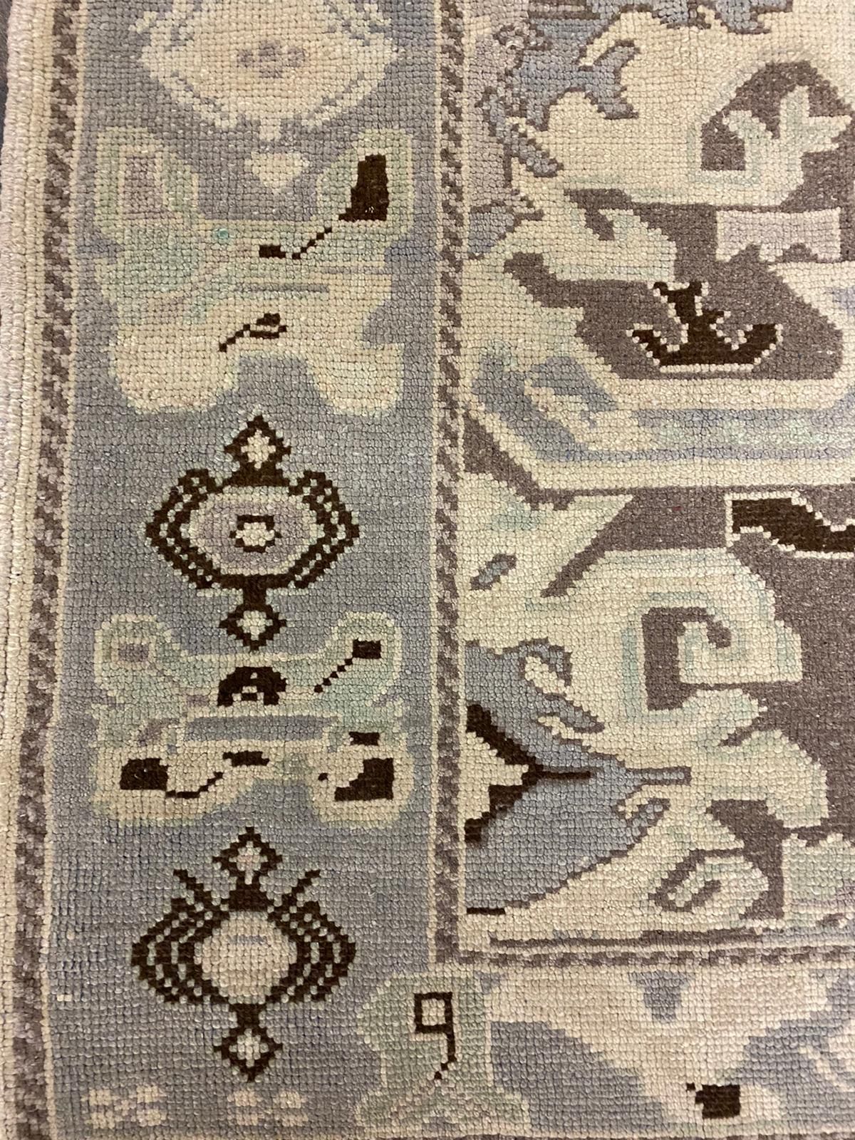 6x9 Ivory and Purple Turkish Tribal Rug