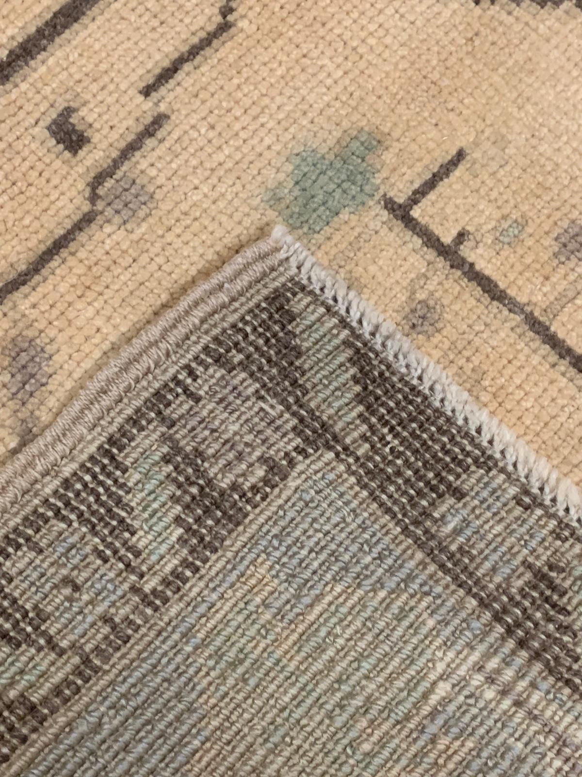 6x9 Ivory and Gold Turkish Tribal Rug