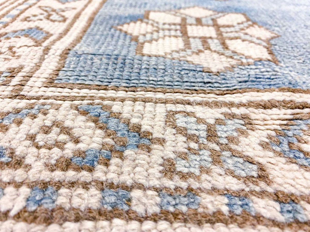 7x10 Blue and Ivory Turkish Tribal Rug