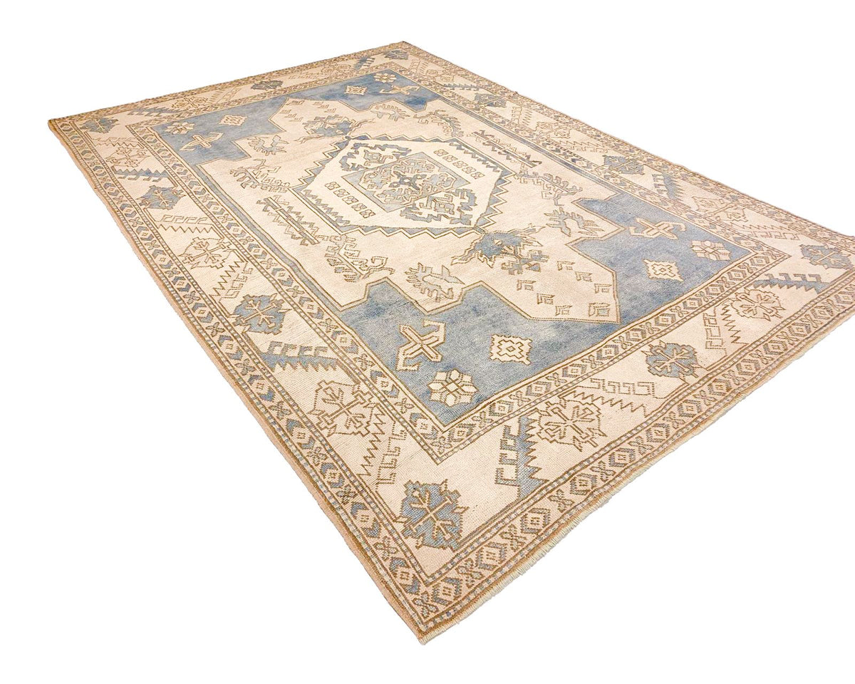 7x10 Blue and Ivory Turkish Tribal Rug