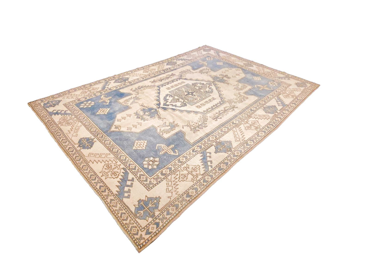 7x10 Blue and Ivory Turkish Tribal Rug