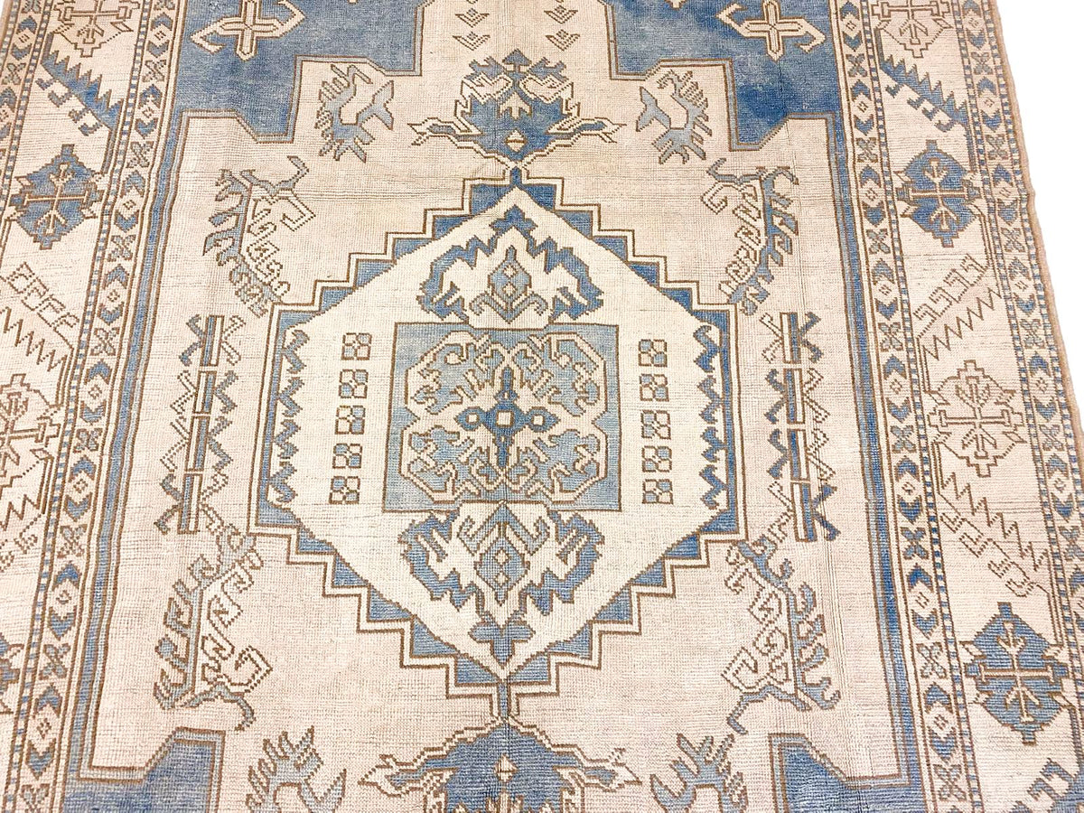 7x10 Blue and Ivory Turkish Tribal Rug