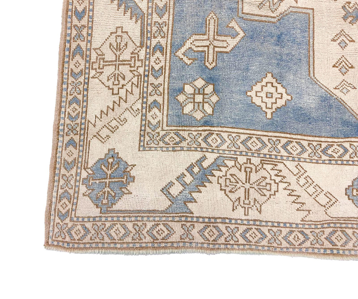 7x10 Blue and Ivory Turkish Tribal Rug