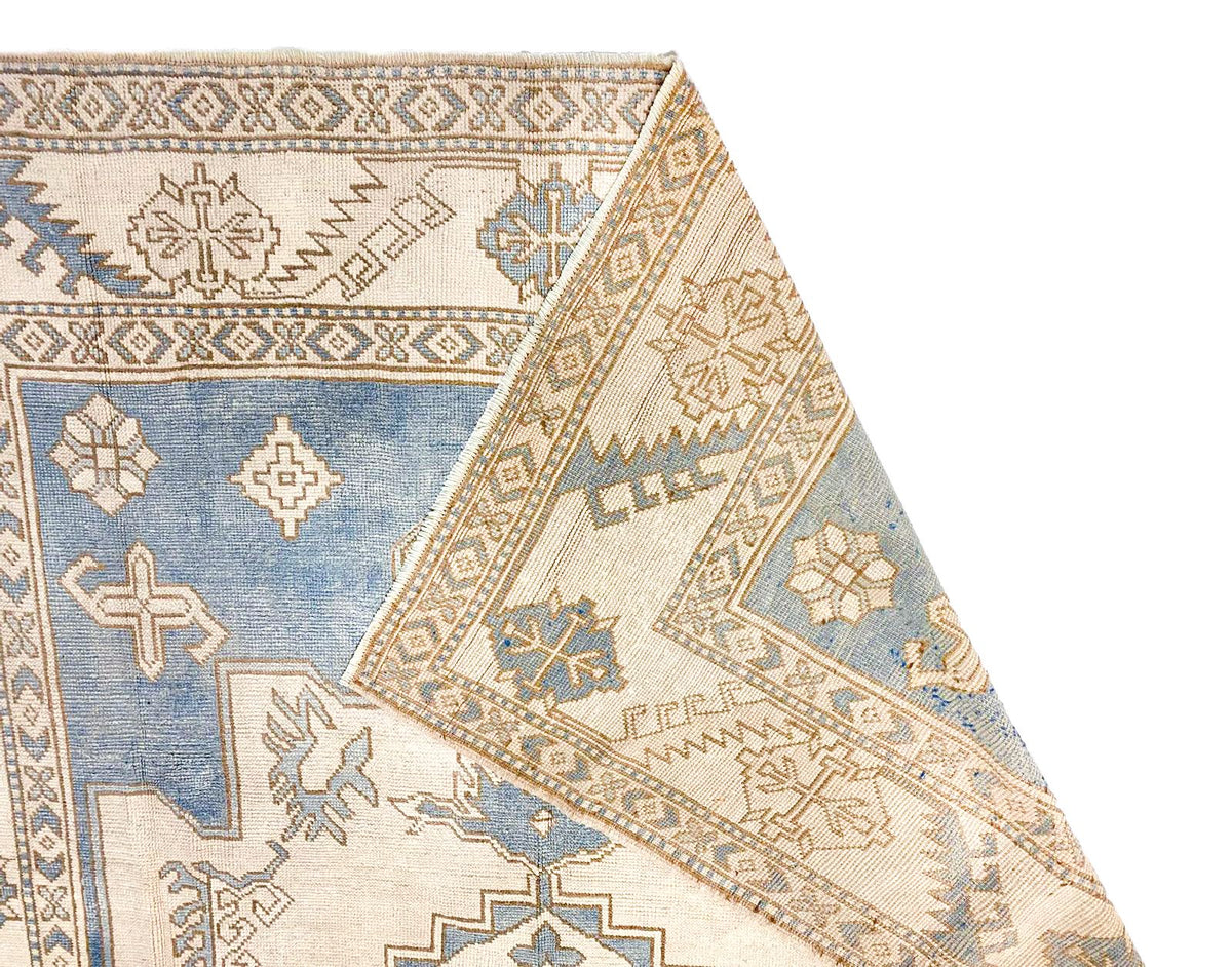 7x10 Blue and Ivory Turkish Tribal Rug