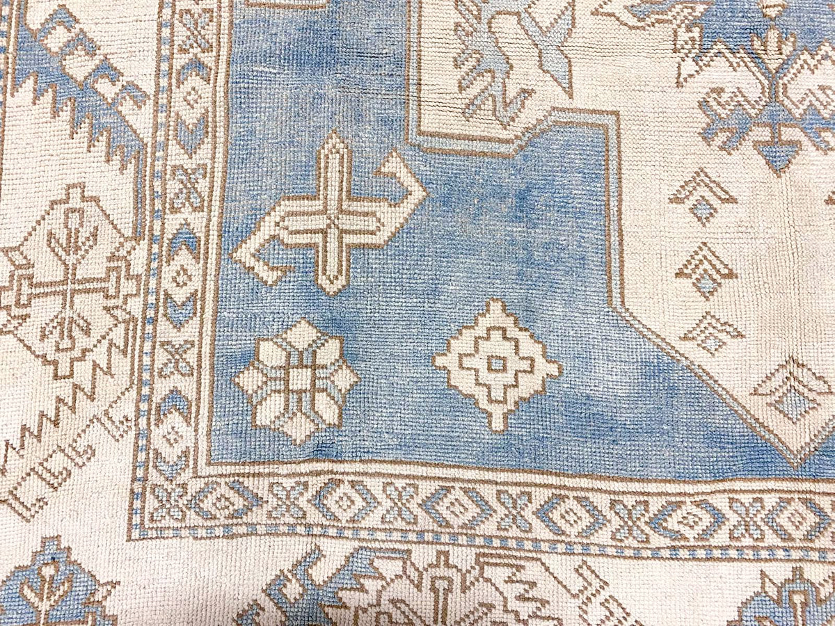 7x10 Blue and Ivory Turkish Tribal Rug